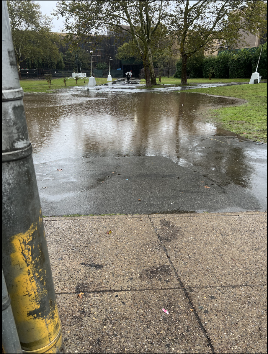 The path/walkup to enter John Dewey High School was completely flooded (September 29, 2023).
