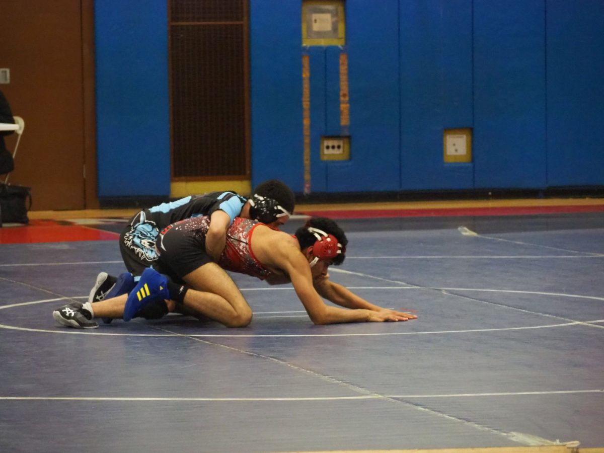 A wrestler from the 2022-2023 season, Herminio Sanchez in the midst of a matchup.
