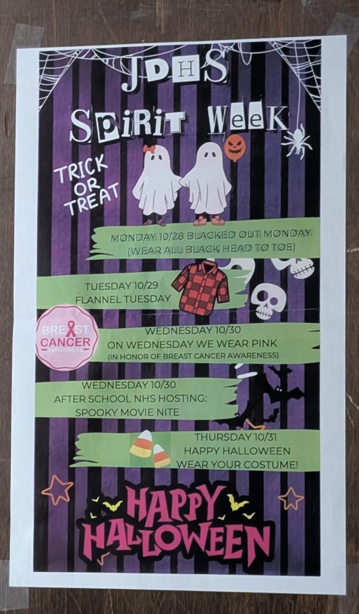 Poster for Spirit Week and its events on a door in John Dewey High School.