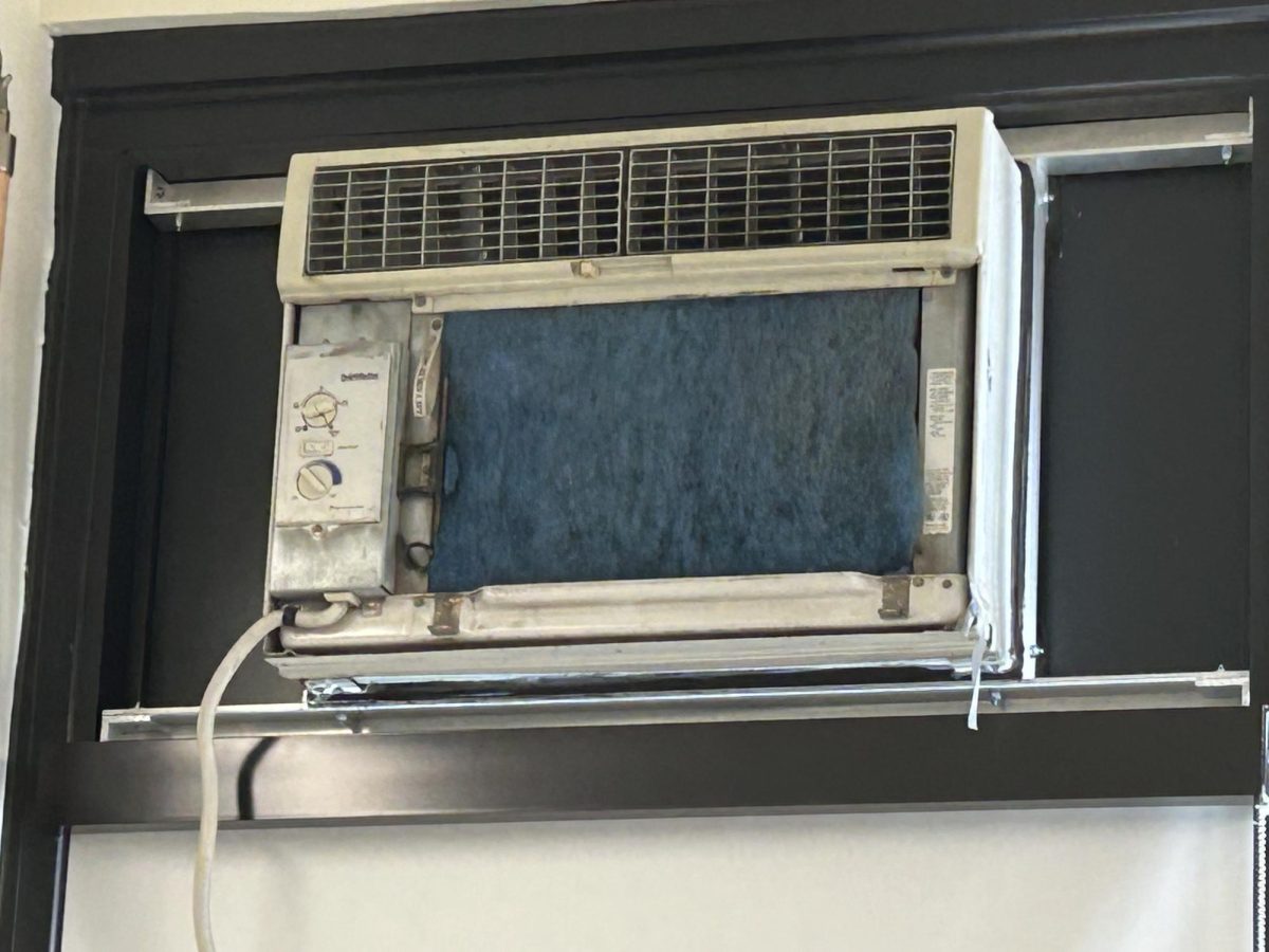 A partially damaged current air conditioner in John Dewey.