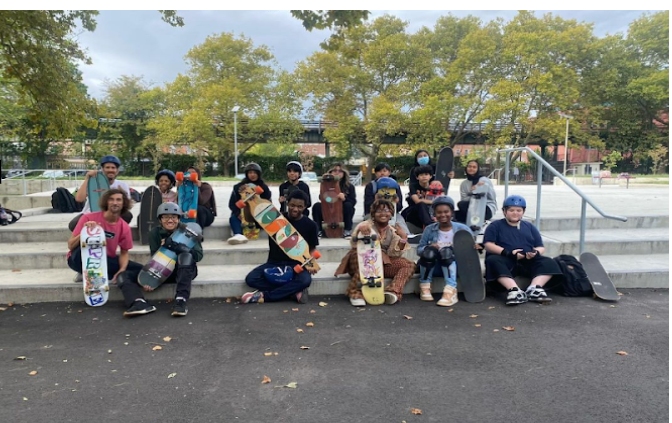 Dewey's Skate Club takes a quick picture before their club session on the school's campus. 