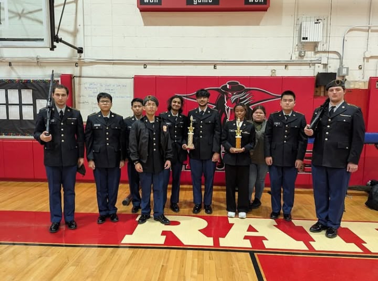 On Saturday, December 7th, 2024, the JROTC poses for a picture with the trophies they won at the Port Richmond HS Round Robin JROTC Competition. 