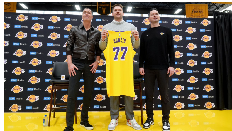 From left: Los Angeles Lakers general manager Rob Pelinka, Luka Doncic, and head coach JJ Redick pose for photos during an introductory NBA basketball press conference on Tuesday, February 4, 2025, in El Segundo, California.
