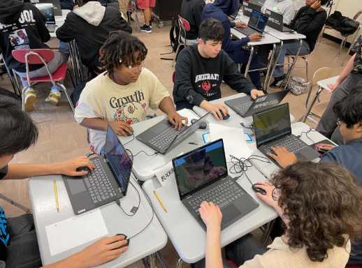 BLOCKHAMPTON team members Isis Copelin and Louis Savino, and other Minecraft teams researching and working on their build.