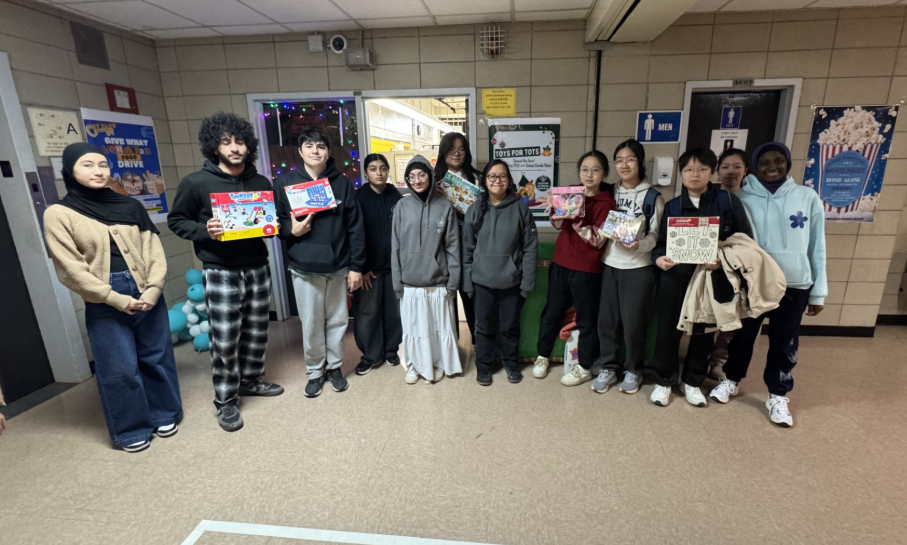 National Honor Society members in front of drop box, located in front of the deans office (Room 163). Students or staff looking to make a toy donation can leave them here.