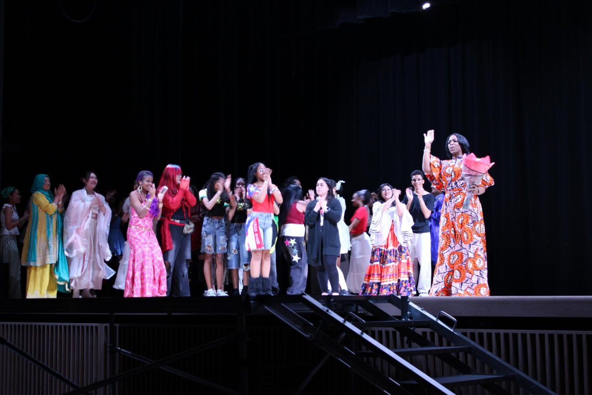Participants gather on stage for the final round of applause during International Night. 
