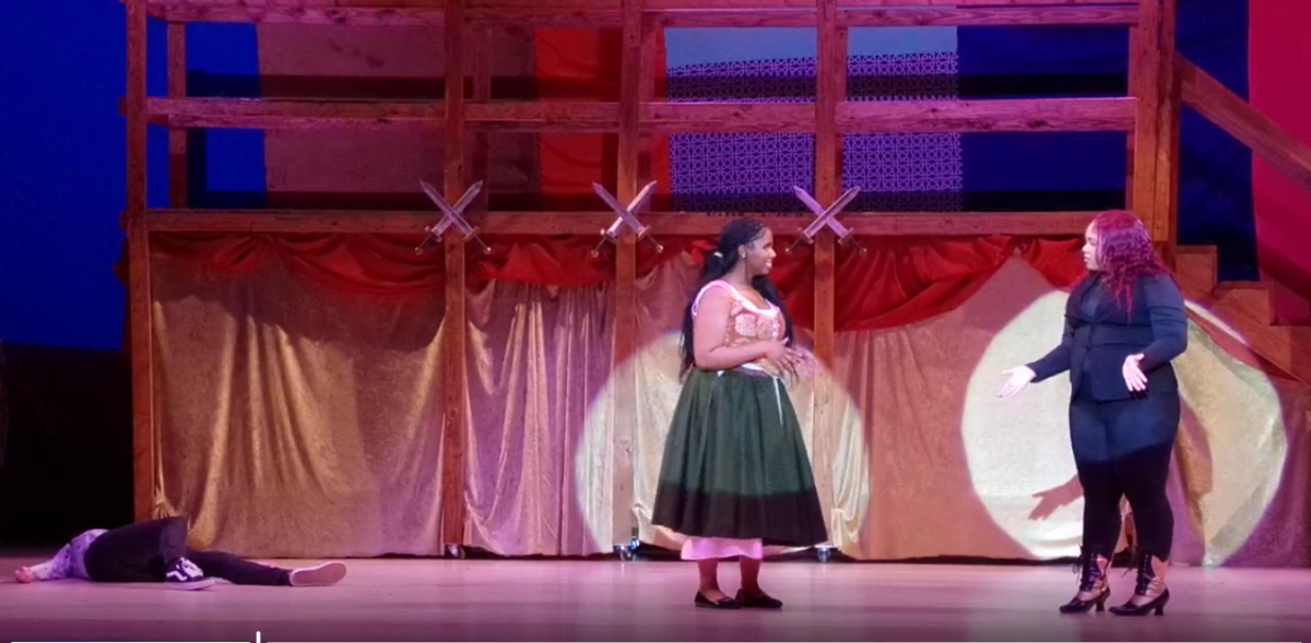 Pictured are 3 actors on JDHS's auditorium stage during the production of Pippin.