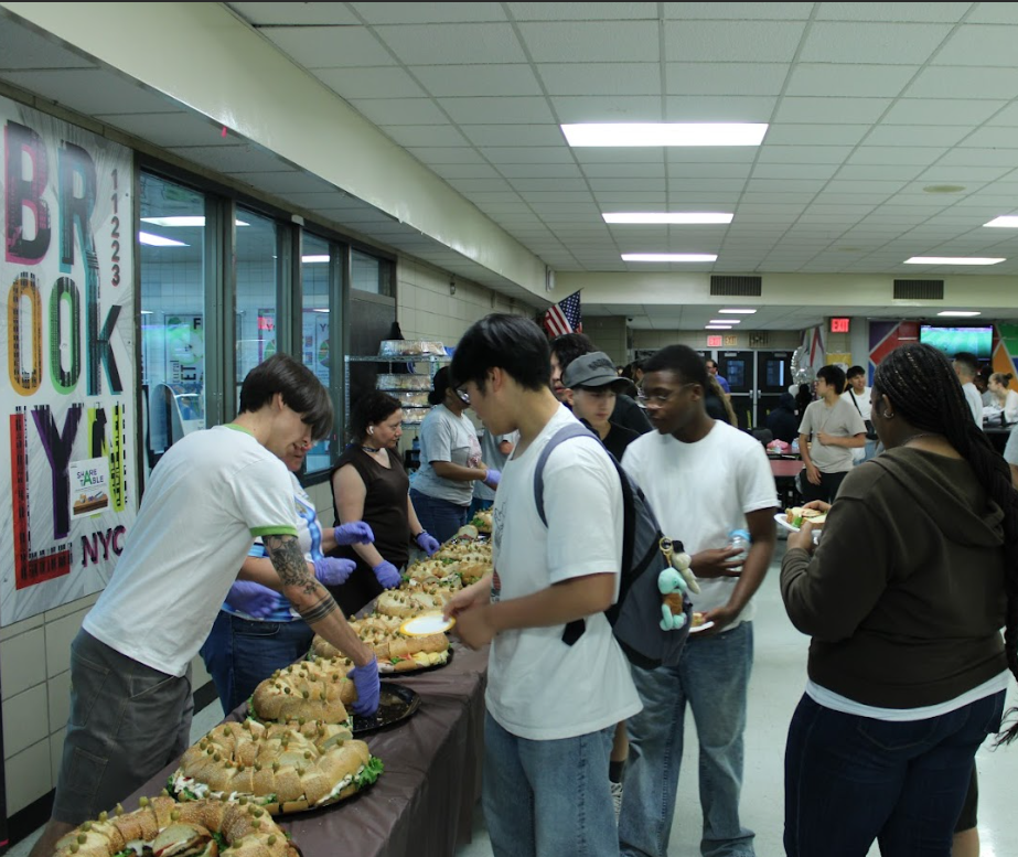 Teacher Volunteers stepping up to help distribute a large catering order to many hungry soccer fans.